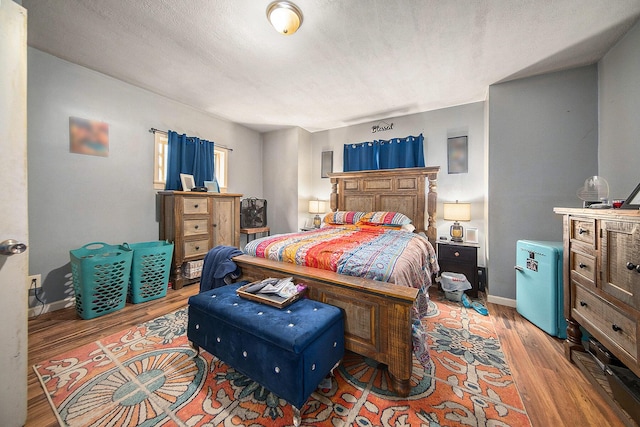 114 Orange St, Jackson, MI 49202 - bedroom with wood finished floors and baseboards