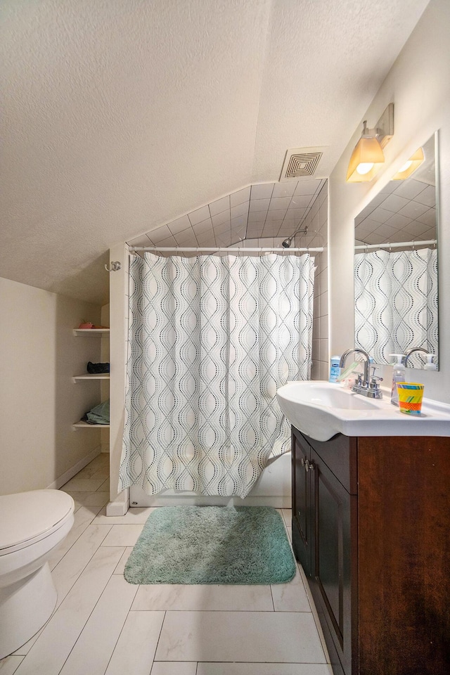 114 Orange St, Jackson, MI 49202 - full bath with toilet, vanity, and a textured ceiling