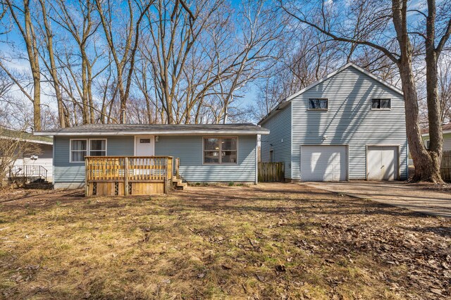 1585 Leeds Ave, Benton Harbor, MI 49022 - view of front of home featuring a deck, driveway, and a garage