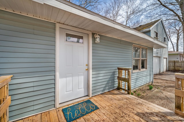 1585 Leeds Ave, Benton Harbor, MI 49022 - property entrance featuring a wooden deck and a garage