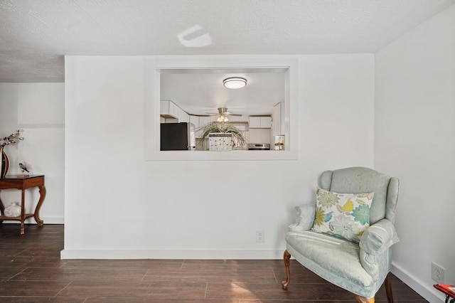 1585 Leeds Ave, Benton Harbor, MI 49022 - sitting room featuring dark wood finished floors, baseboards, and ceiling fan