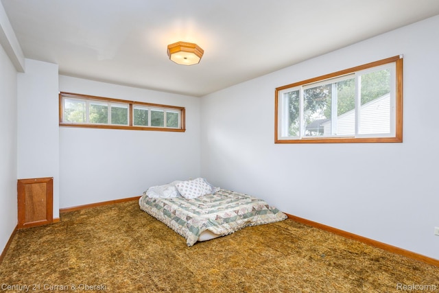2548 Hearthside Dr, Ypsilanti, MI 48198 - bedroom featuring multiple windows, carpet floors, and baseboards
