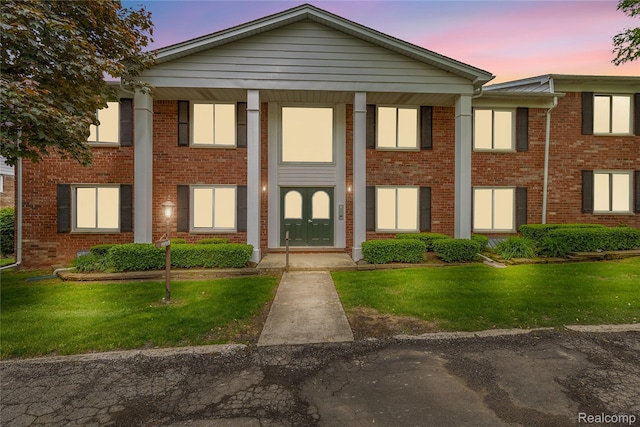 2375 Mulberry Sq Unit 69, Bloomfield Hills, MI 48302 - neoclassical home with a front yard and brick siding