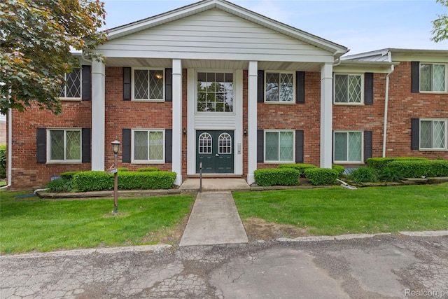2375 Mulberry Sq Unit 69, Bloomfield Hills, MI 48302 - neoclassical home featuring a front yard and brick siding