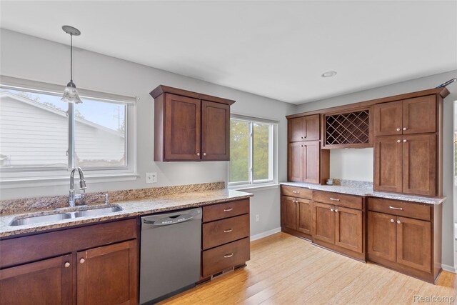 2375 Mulberry Sq Unit 69, Bloomfield Hills, MI 48302 - kitchen with dishwasher, a sink, light wood-style floors, baseboards, and pendant lighting