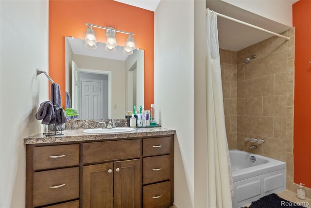 2375 Mulberry Sq Unit 69, Bloomfield Hills, MI 48302 - bathroom with vanity, shower / bath combo with shower curtain, and baseboards