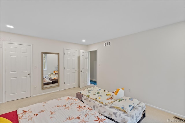2375 Mulberry Sq Unit 69, Bloomfield Hills, MI 48302 - bedroom with light carpet, baseboards, and recessed lighting