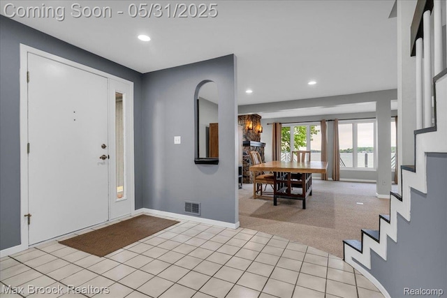 2222 Garland St, Sylvan Lake, MI 48320 - foyer entrance featuring recessed lighting, stairs, light colored carpet, baseboards, and light tile patterned floors