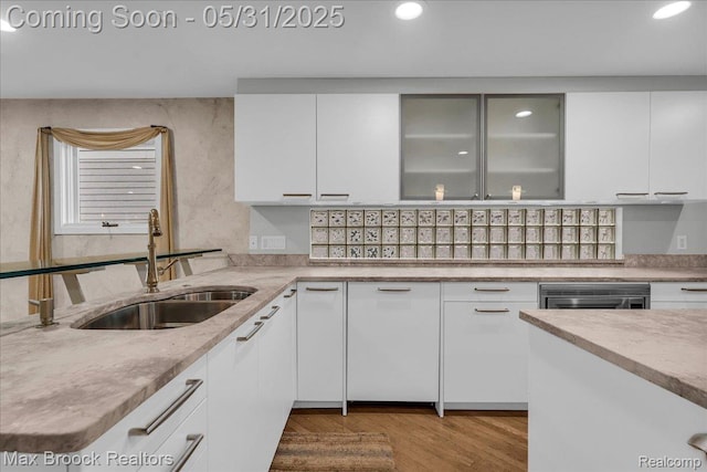 2222 Garland St, Sylvan Lake, MI 48320 - kitchen with a sink, white cabinets, recessed lighting, wood finished floors, and light stone counters