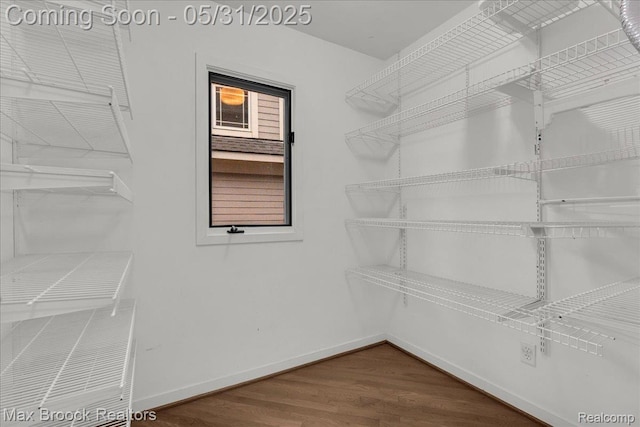 2222 Garland St, Sylvan Lake, MI 48320 - spacious closet featuring dark wood-style flooring
