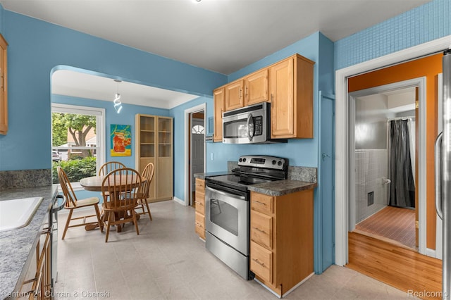 3135 Raymond Ave, Dearborn, MI 48124 - kitchen with stainless steel appliances and light brown cabinets