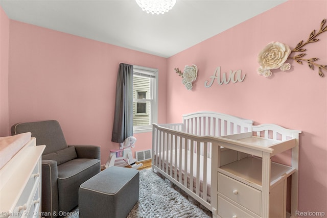 3135 Raymond Ave, Dearborn, MI 48124 - bedroom featuring a nursery area and baseboards