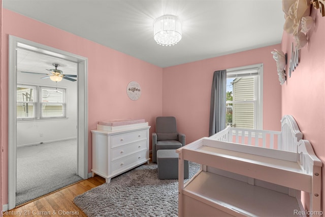 3135 Raymond Ave, Dearborn, MI 48124 - bedroom featuring light wood-style flooring, a chandelier, and baseboards