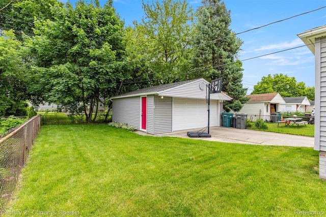 3135 Raymond Ave, Dearborn, MI 48124 - view of yard featuring a detached garage and an outbuilding