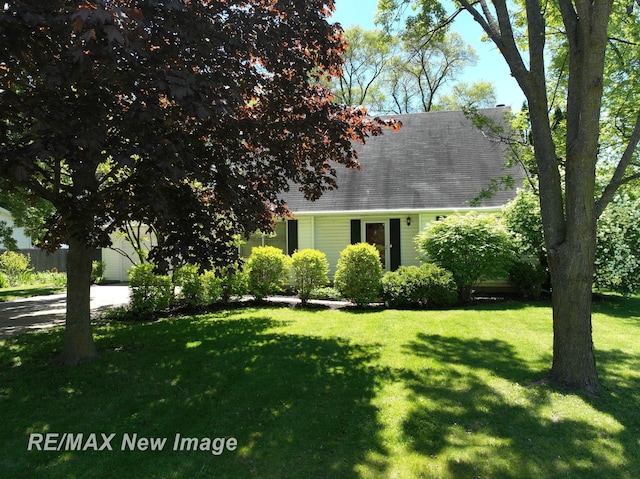 5475 George St, Saginaw, MI 48603 - cape cod-style house with a front yard and roof with shingles