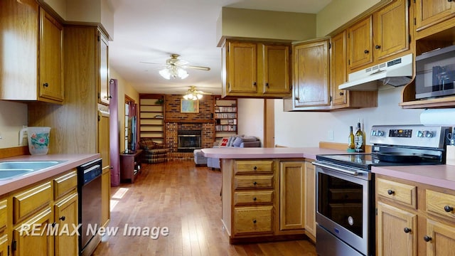 5475 George St, Saginaw, MI 48603 - kitchen with stainless steel electric range, under cabinet range hood, dishwasher, a peninsula, and a ceiling fan