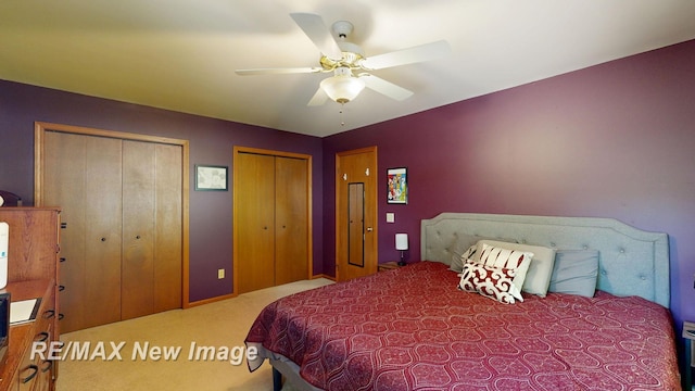 5475 George St, Saginaw, MI 48603 - carpeted bedroom featuring multiple closets and ceiling fan