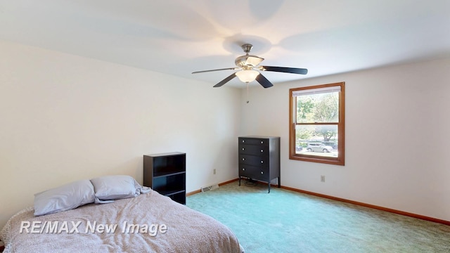 5475 George St, Saginaw, MI 48603 - bedroom with light carpet, baseboards, and a ceiling fan