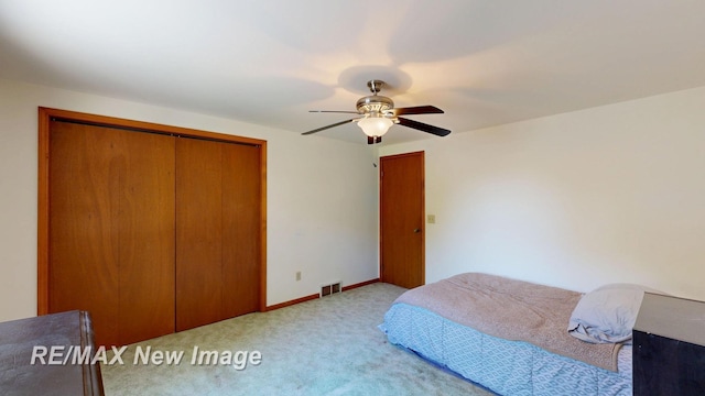 5475 George St, Saginaw, MI 48603 - carpeted bedroom with a closet and a ceiling fan