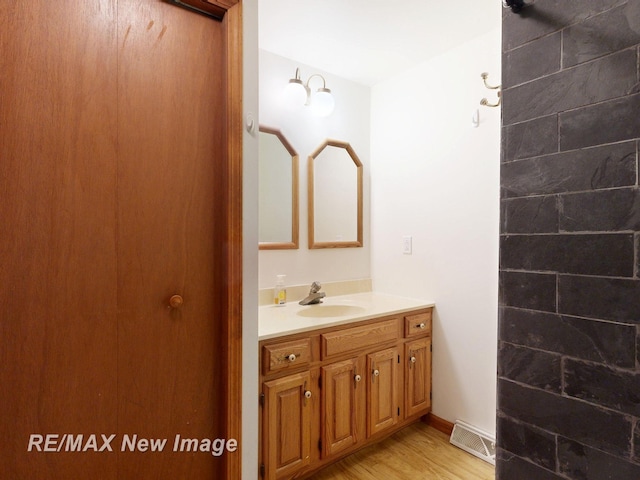 5475 George St, Saginaw, MI 48603 - bathroom with vanity and wood finished floors