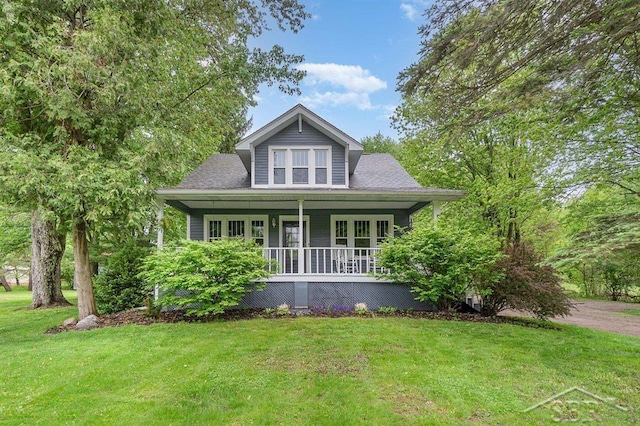 1784 S Badour Rd, Midland, MI 48640 - bungalow featuring covered porch and a front yard