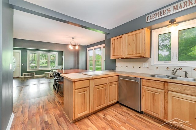 1784 S Badour Rd, Midland, MI 48640 - kitchen with stainless steel dishwasher, a sink, light brown cabinetry, and light wood-type flooring
