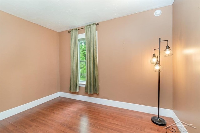 1784 S Badour Rd, Midland, MI 48640 - spare room with baseboards and wood finished floors