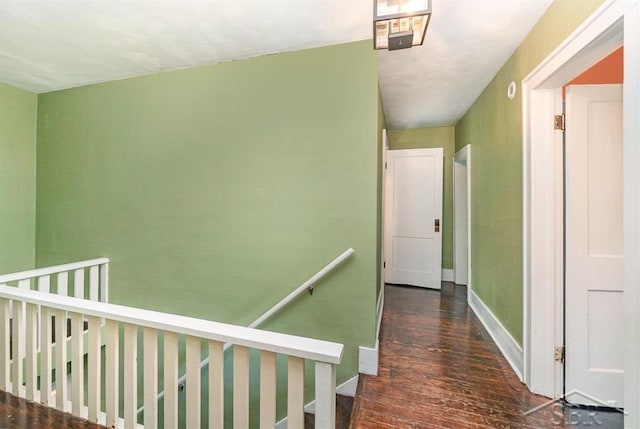 1784 S Badour Rd, Midland, MI 48640 - hall featuring wood finished floors, baseboards, and an upstairs landing
