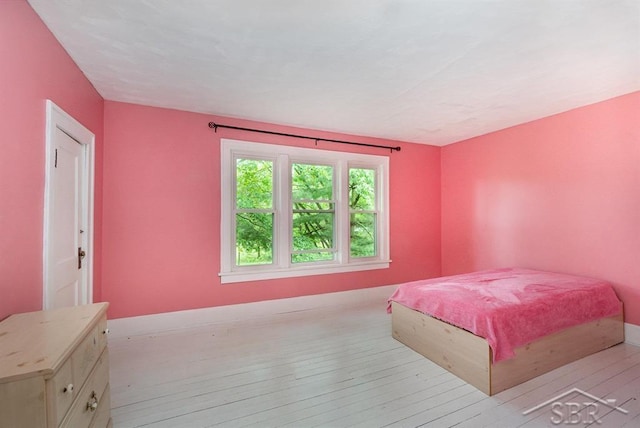 1784 S Badour Rd, Midland, MI 48640 - bedroom with light wood-style flooring