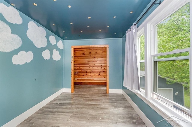 1784 S Badour Rd, Midland, MI 48640 - empty room featuring baseboards and wood finished floors