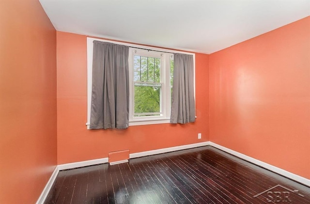 1784 S Badour Rd, Midland, MI 48640 - empty room with hardwood / wood-style flooring and baseboards