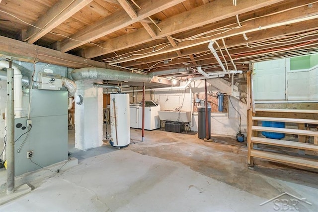 1784 S Badour Rd, Midland, MI 48640 - unfinished below grade area featuring gas water heater, washing machine and dryer, a sink, a water softener, and heating unit