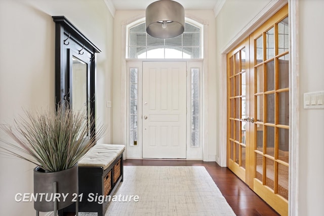 2170 Chestnut Rdg, Saginaw, MI 48609 - foyer entrance with french doors and dark wood-type flooring