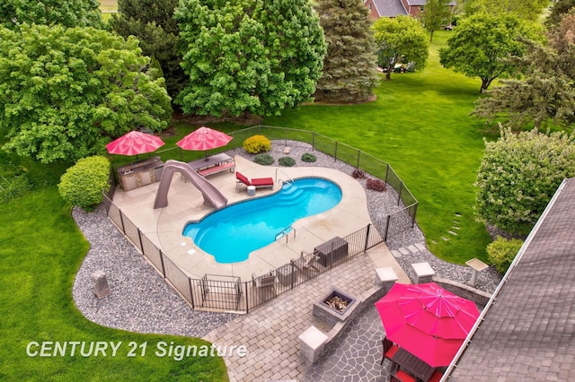2170 Chestnut Rdg, Saginaw, MI 48609 - view of swimming pool with an outdoor fire pit, a patio area, and a water slide