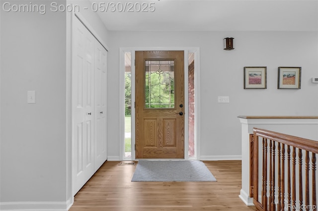 9587 Harmon Ln, South Lyon, MI 48178 - entryway featuring wood finished floors and baseboards