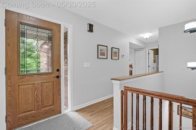 9587 Harmon Ln, South Lyon, MI 48178 - foyer featuring light wood finished floors and baseboards