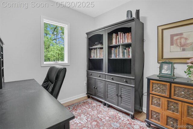 9587 Harmon Ln, South Lyon, MI 48178 - office featuring wood finished floors and baseboards
