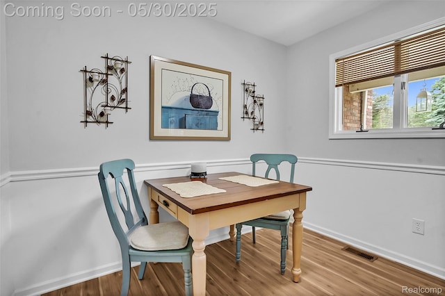 9587 Harmon Ln, South Lyon, MI 48178 - dining area featuring wood finished floors, baseboards, and a desk