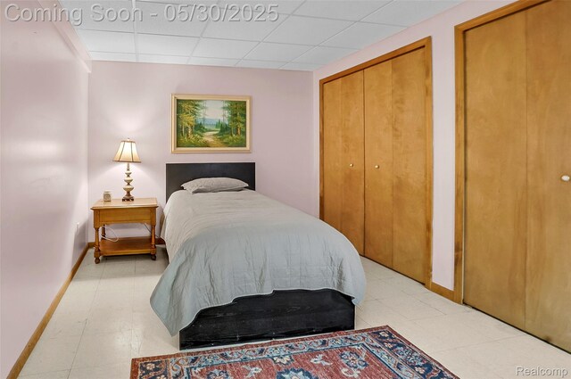 9587 Harmon Ln, South Lyon, MI 48178 - bedroom with baseboards and a paneled ceiling