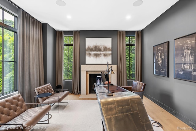 608 Stanley Blvd, Birmingham, MI 48009 - home office featuring a fireplace with flush hearth, wood finished floors, healthy amount of natural light, and recessed lighting