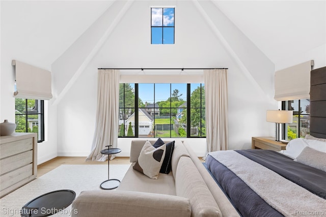 608 Stanley Blvd, Birmingham, MI 48009 - bedroom featuring high vaulted ceiling, wood finished floors, and baseboards