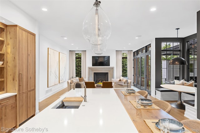 608 Stanley Blvd, Birmingham, MI 48009 - living room with light wood-type flooring, a fireplace, baseboards, and recessed lighting