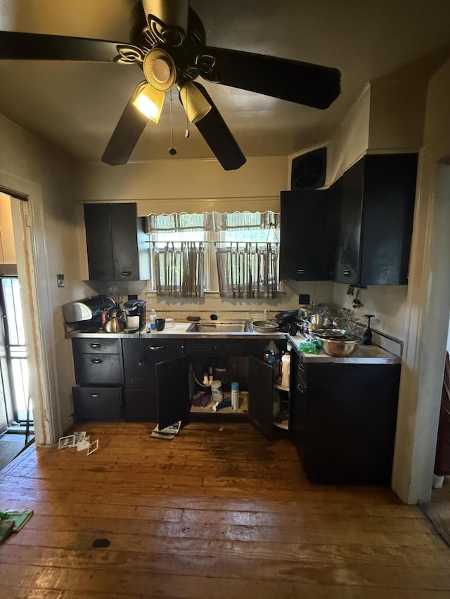 9142 Yorkshire Rd, Detroit, MI 48224 - kitchen featuring hardwood / wood-style flooring, dark cabinetry, and ceiling fan