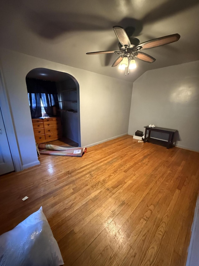 9142 Yorkshire Rd, Detroit, MI 48224 - spare room with arched walkways, hardwood / wood-style flooring, ceiling fan, baseboards, and vaulted ceiling