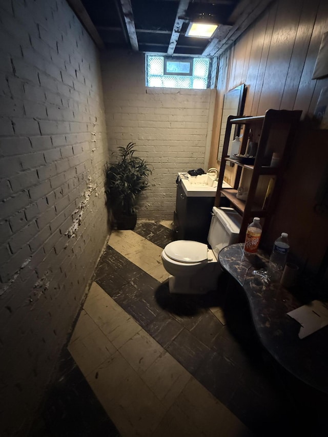 9142 Yorkshire Rd, Detroit, MI 48224 - bathroom with toilet and brick wall