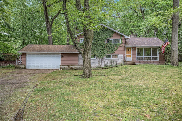 125 Christy Rd, Battle Creek, MI 49015 - tri-level home featuring driveway, a front yard, and a chimney