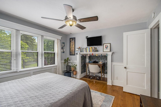 2313 S Westnedge Ave, Kalamazoo, MI 49008 - bedroom with hardwood / wood-style floors, wainscoting, and ceiling fan