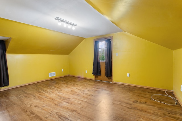 222 Oak St, South Haven, MI 49090 - additional living space with wood finished floors, lofted ceiling, and baseboards