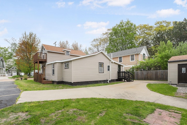 222 Oak St, South Haven, MI 49090 - view of side of home featuring driveway and a balcony