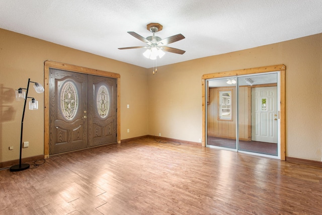 222 Oak St, South Haven, MI 49090 - entryway with wood finished floors, ceiling fan, baseboards, and french doors